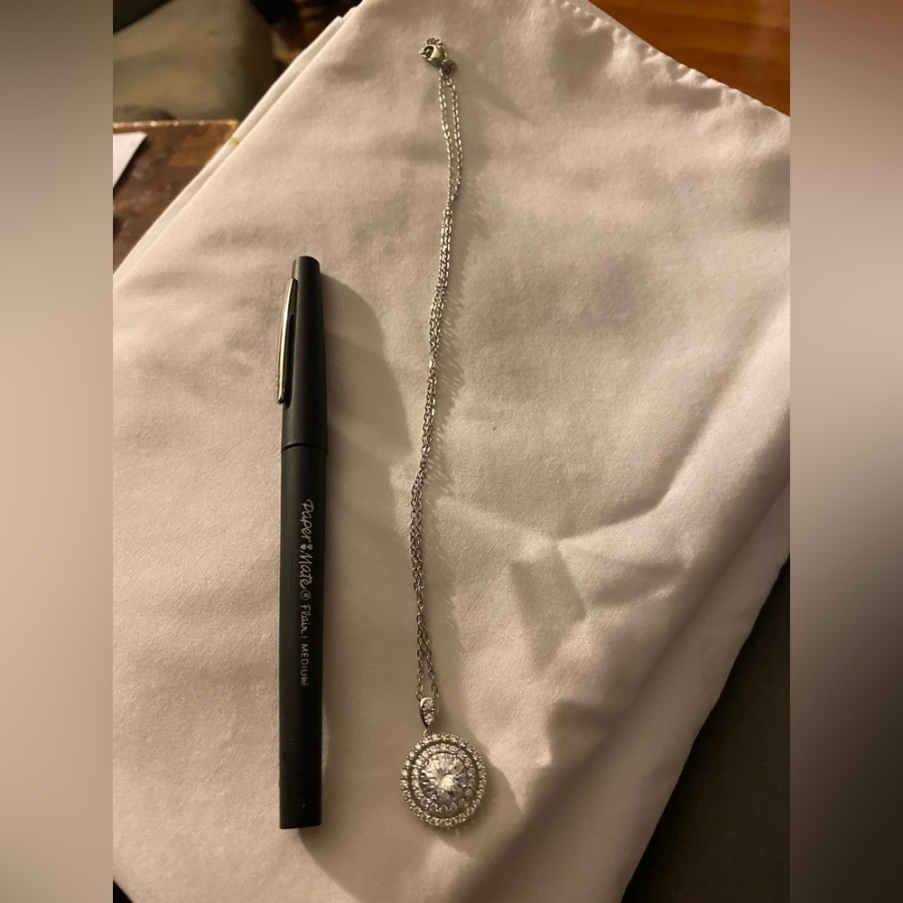 Silver gem with mini gems around it. NWOT.